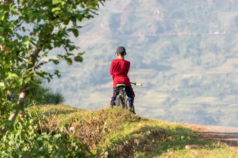 a person that is standing on top of a hill