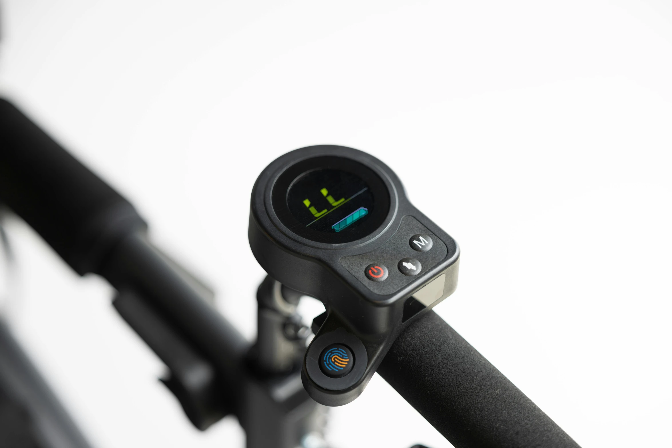 a bike's handlebar is shown with an analog display