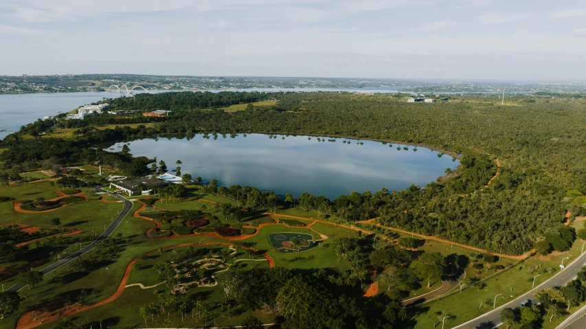 a scenic view of a lake, wooded area and large body of water