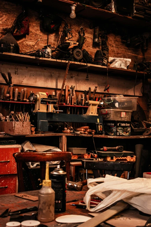 old toolboxes, tools and wooden shelves in a shop