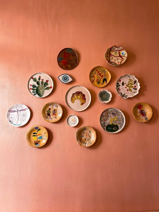 a room filled with lots of plates on a wall