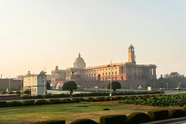 a tall building with a clock tower is seen in the distance