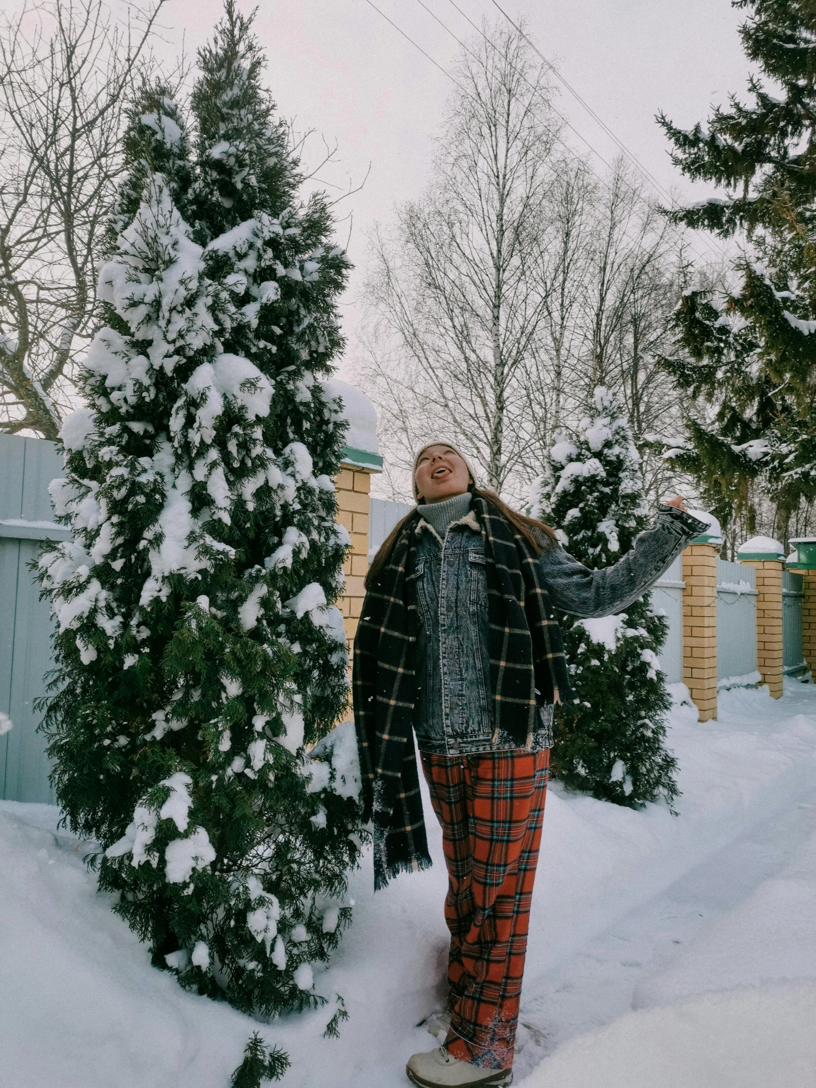 a man who is snowboarding standing in the snow