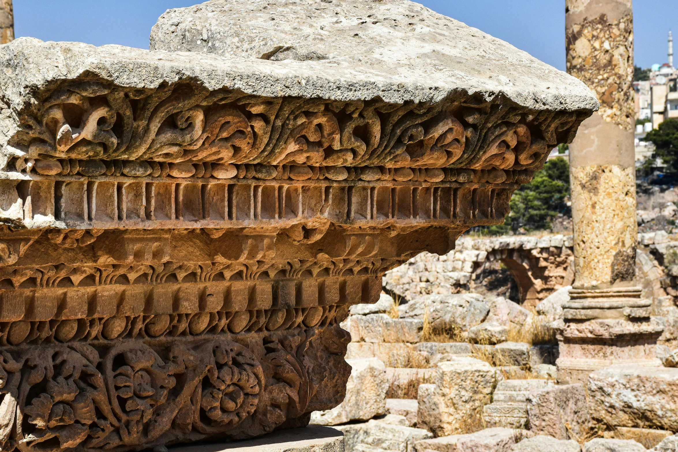 an interesting structure is surrounded by stone pillars