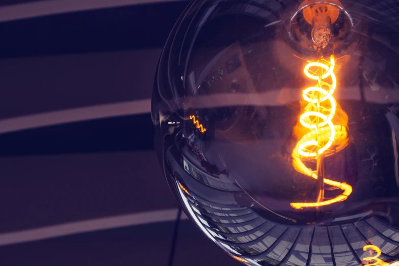 a close up of a disco ball with the light on