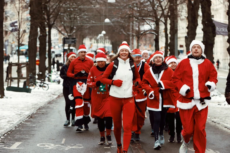 a large group of people dressed in christmas clothes