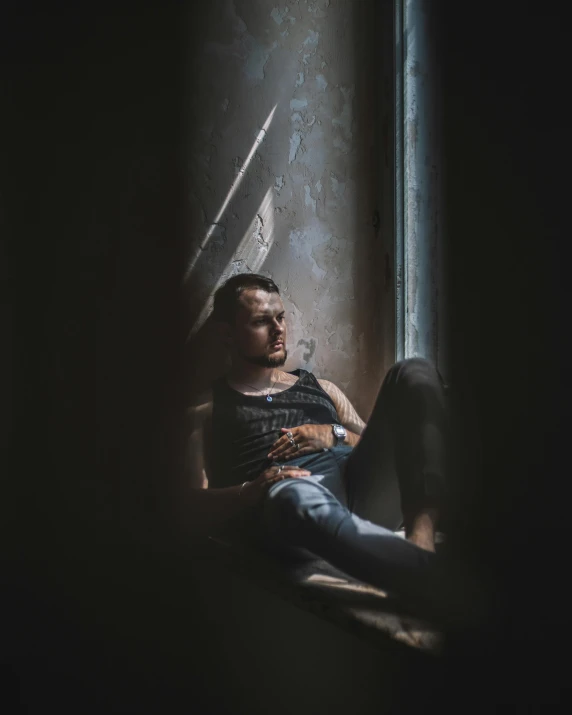 a man looking up at the sky while wearing a shirt and jeans