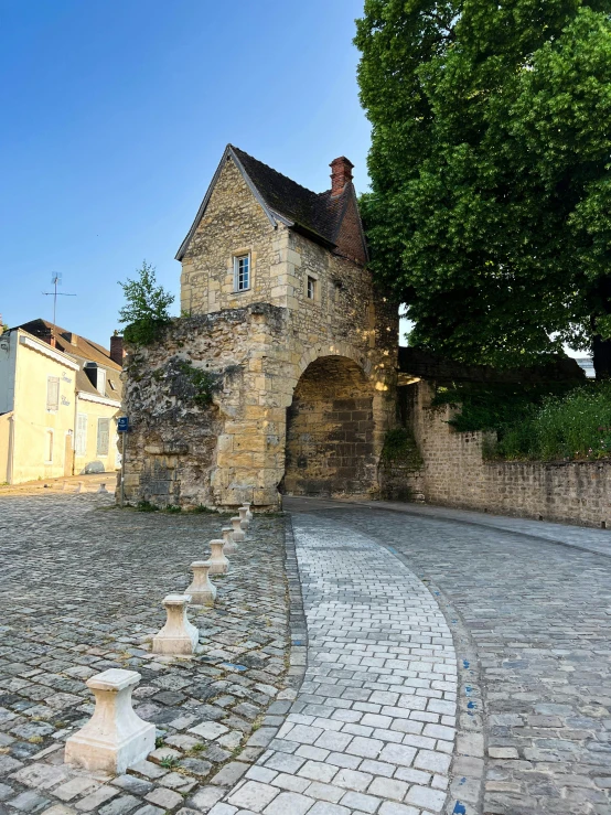 a brick building on the side of a road