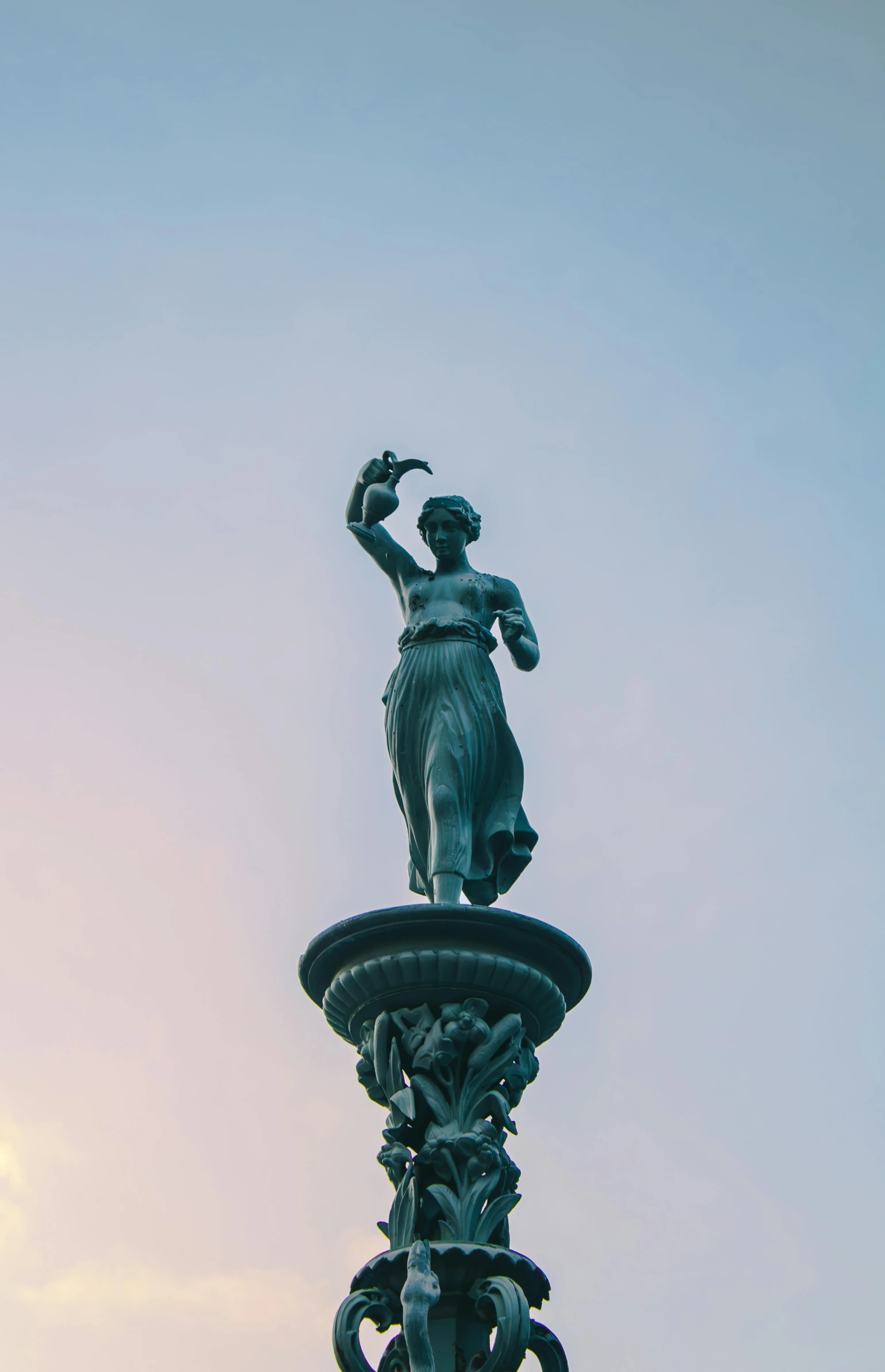 a statue of a man on top of a tower