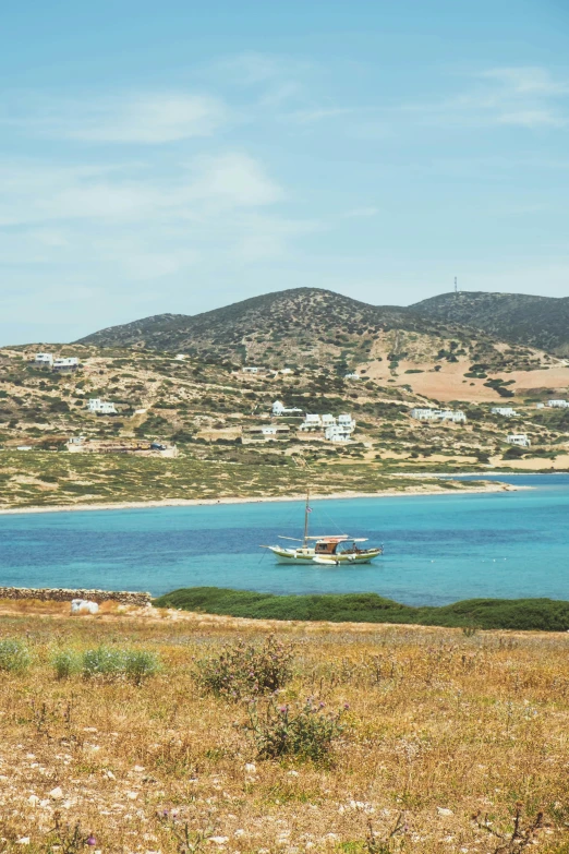 a boat in the water near a shore