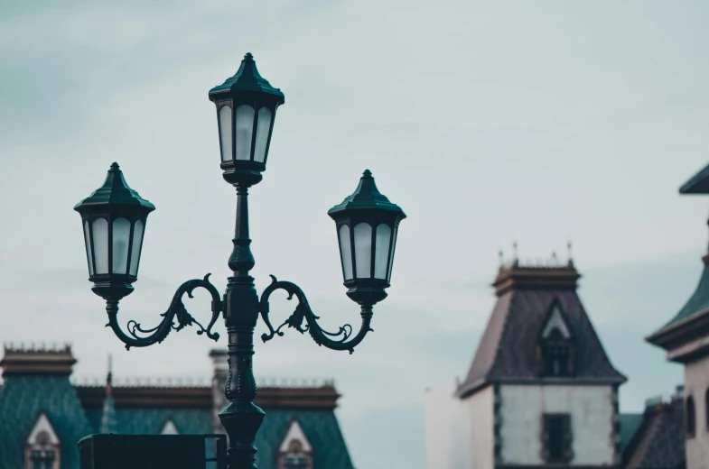 the street lamp is in front of the old castle