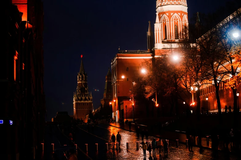 the view of a city street at night from across the street