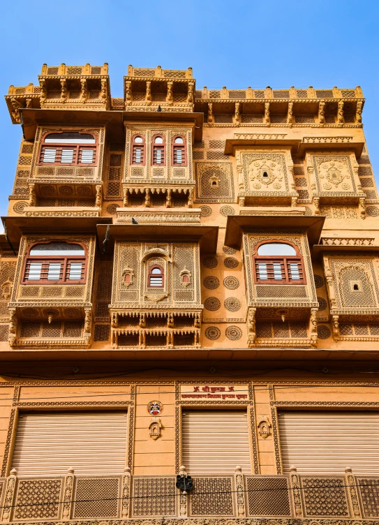 a tall building with wooden balconies and balconies on each floor