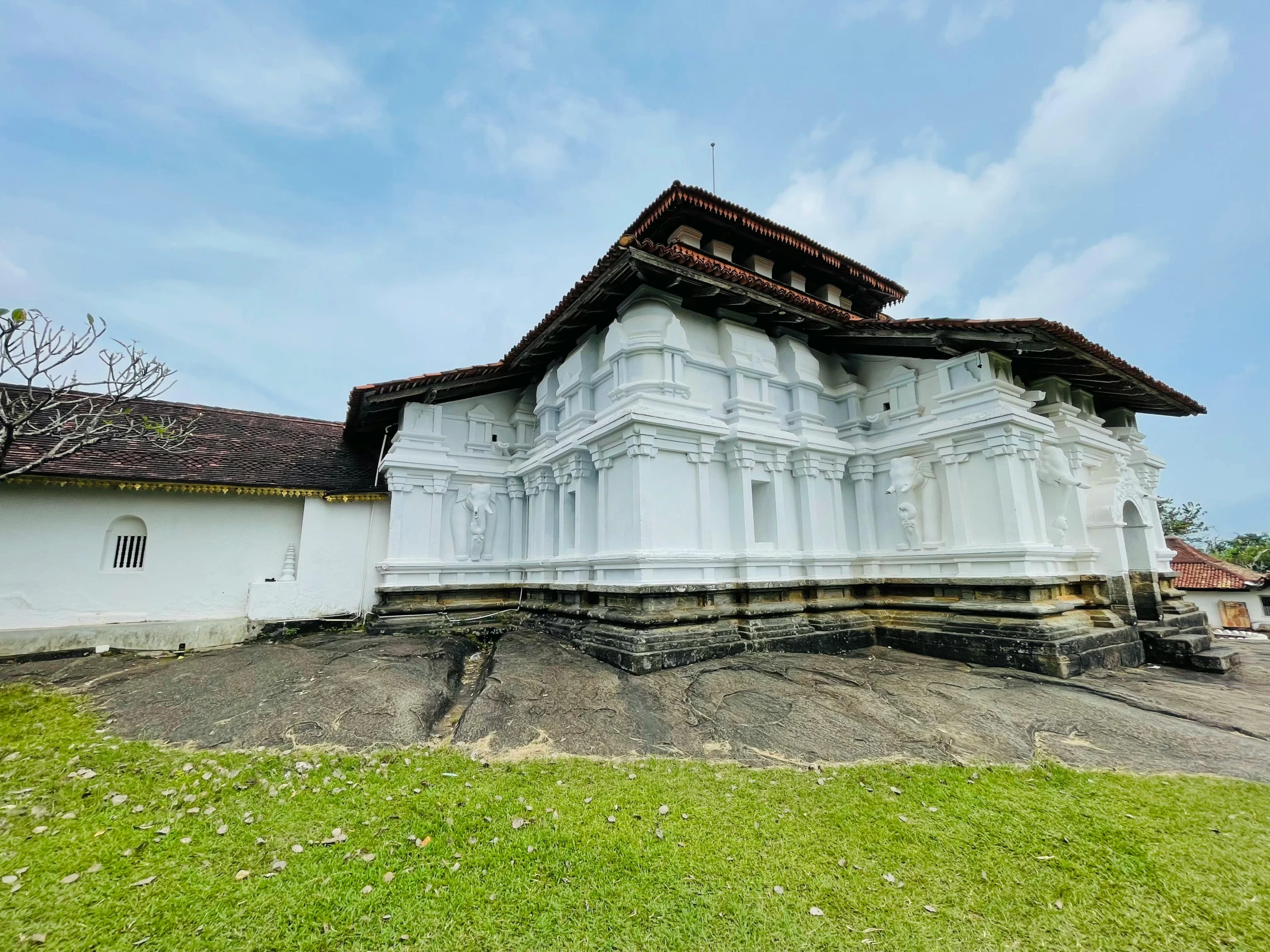 a large white house on top of a hill