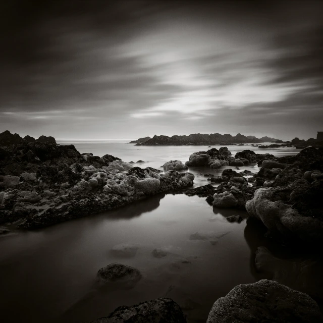 this is a po of an ocean coast and some rocks