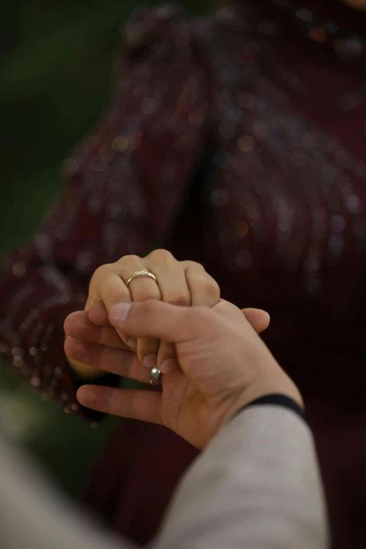 the bride and groom hold hands together