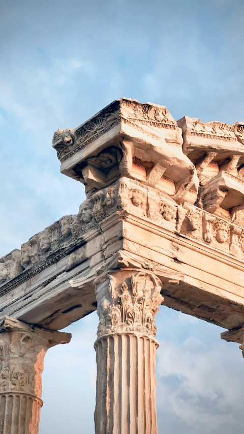 an ancient structure with columns in front