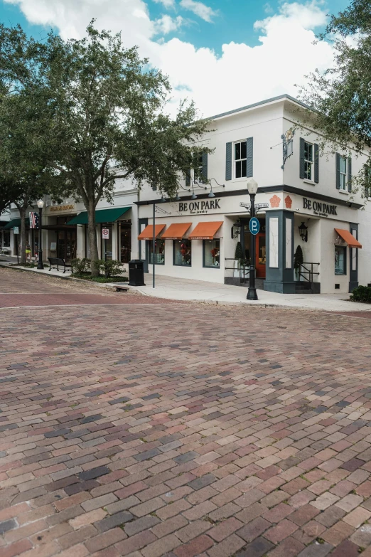 a very cute building that has some orange awnings