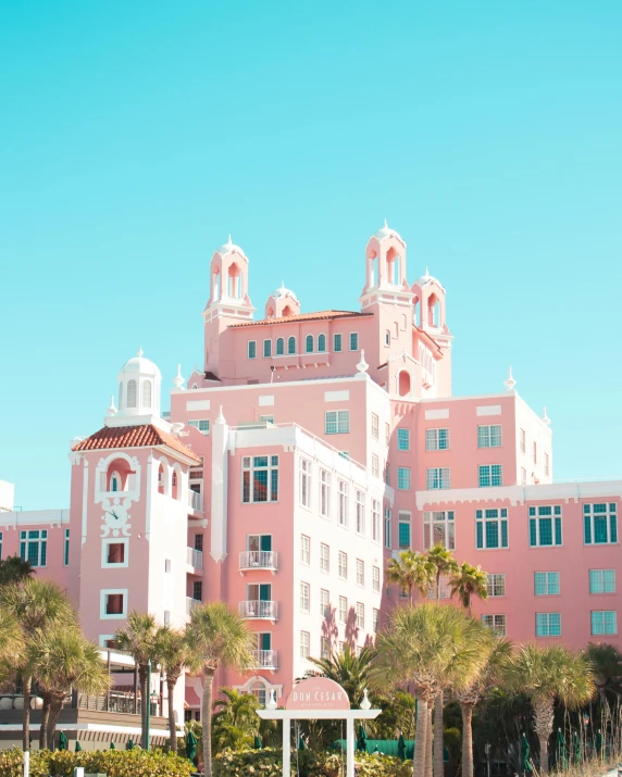 the large pink building has two clock towers