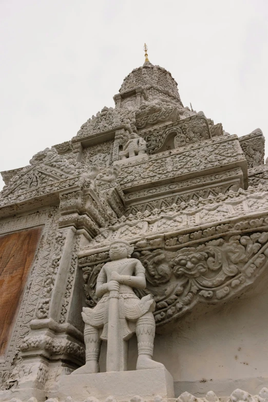 statue with elephant and rider near brick wall