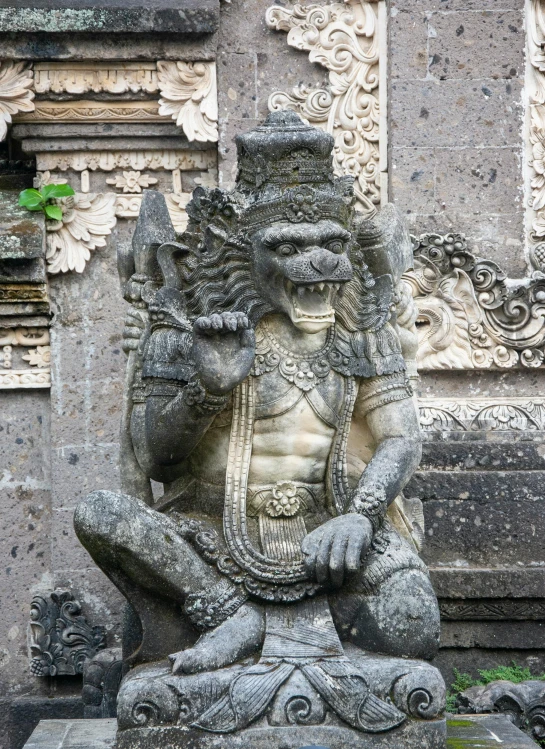 a stone statue depicting the god rama in a pose