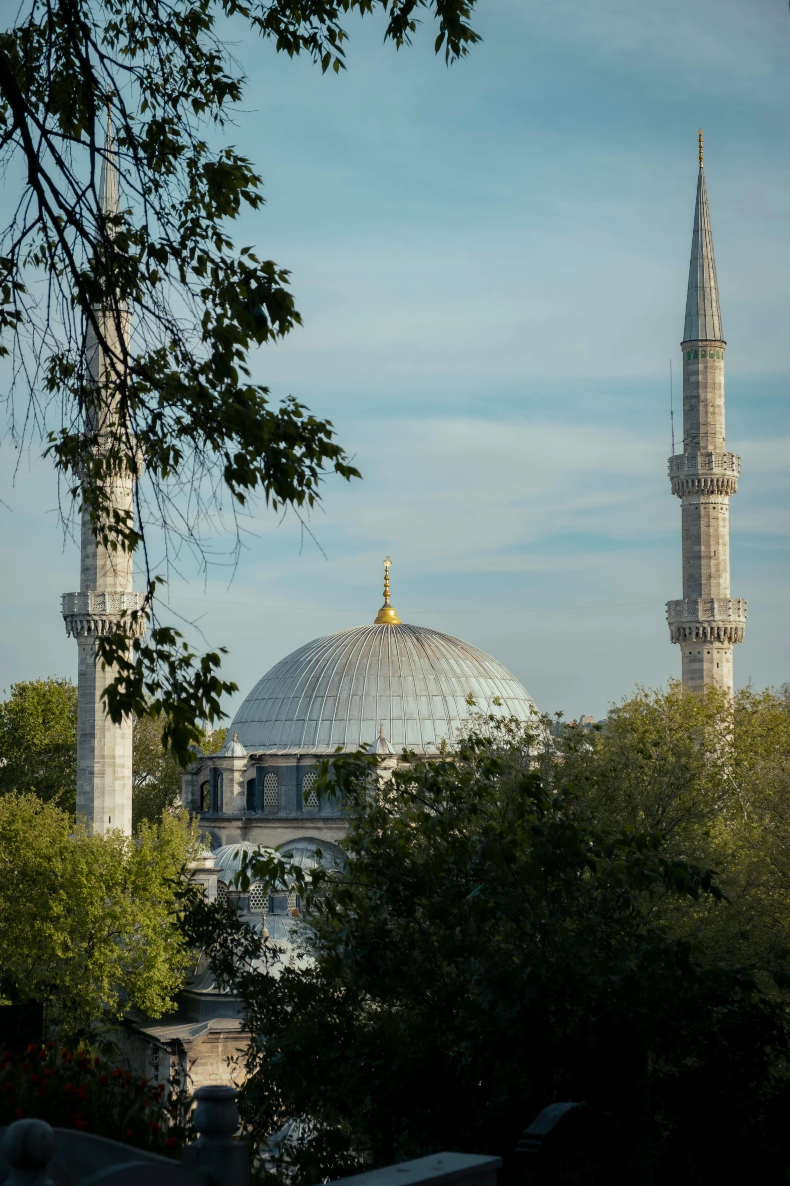 a large tall building with a spire that looks like a dome