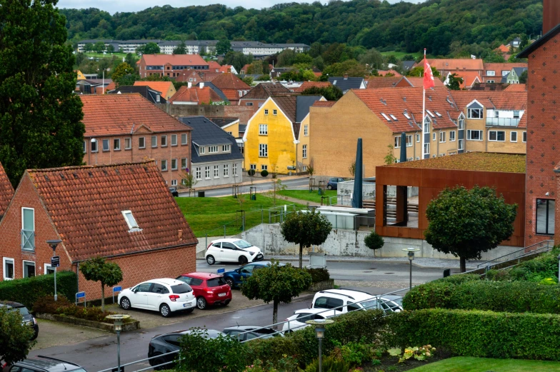 the small town is dotted with cars and houses