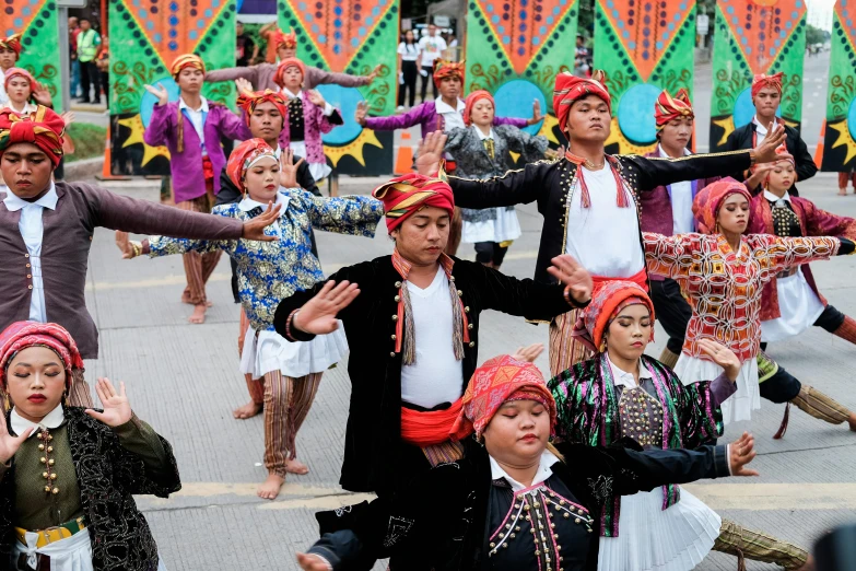 some people in elaborate clothes doing a dance