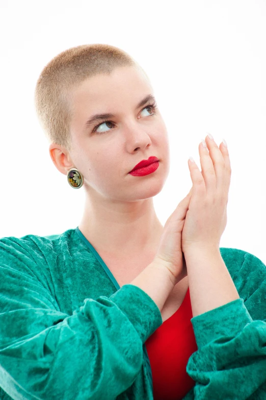 woman wearing green and red outfit looking away from camera