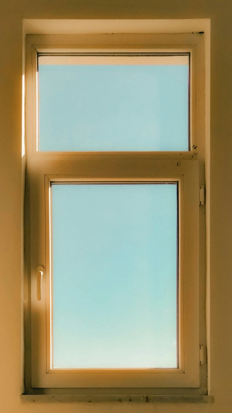 two windows with the blue sky seen through