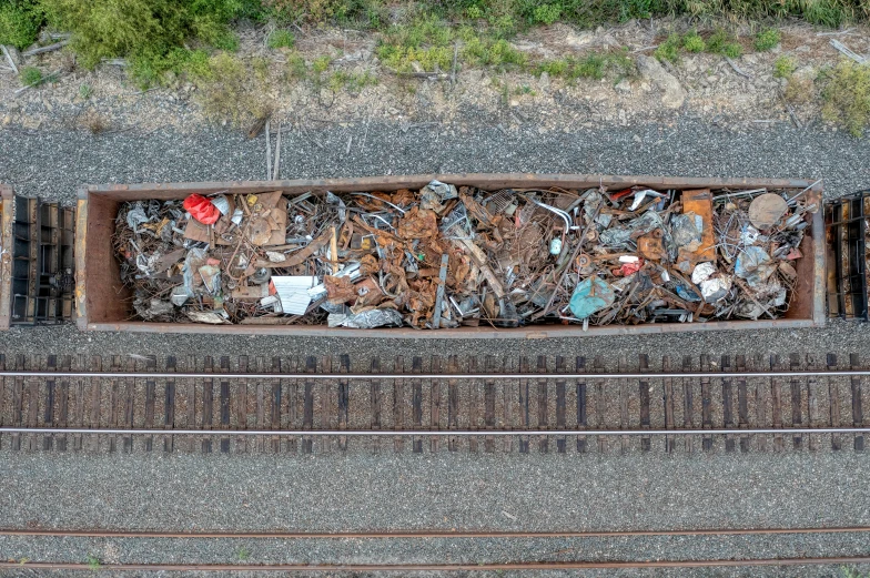 a top view of a train track with some broken metal on it