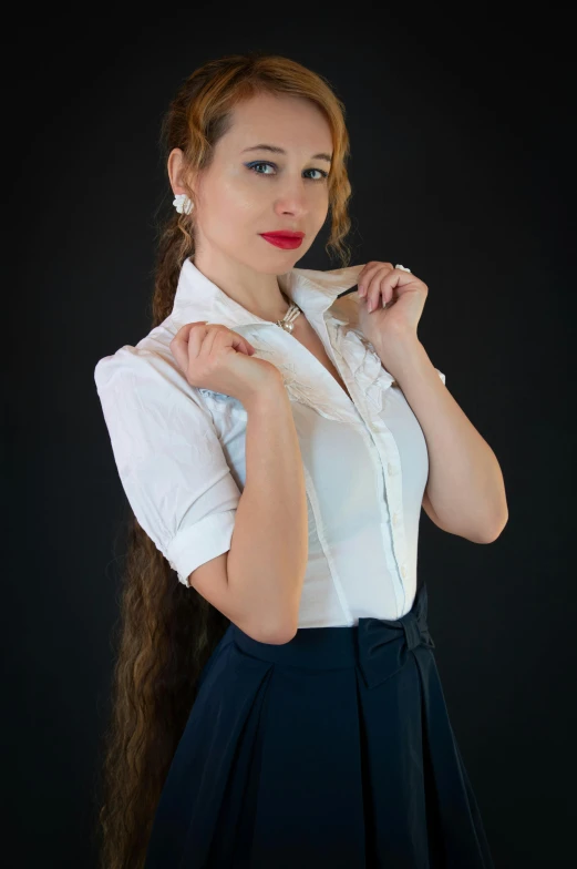 a woman with long hair is wearing a white blouse and dark skirt