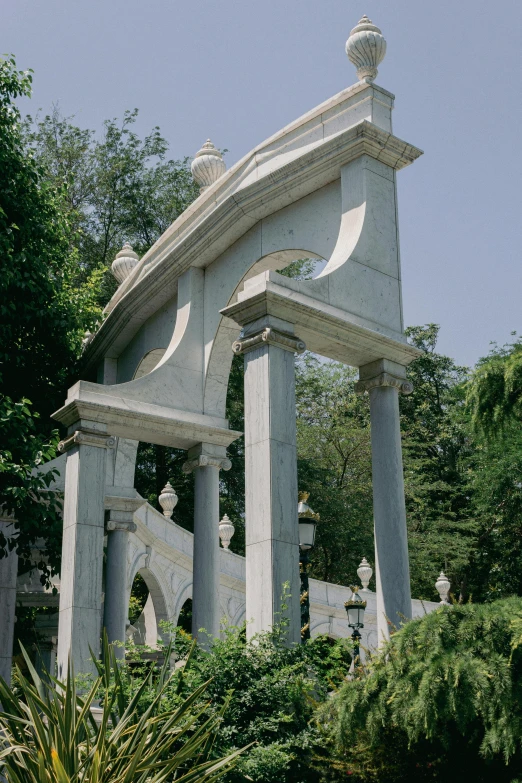 a monument with stone pillars in the middle