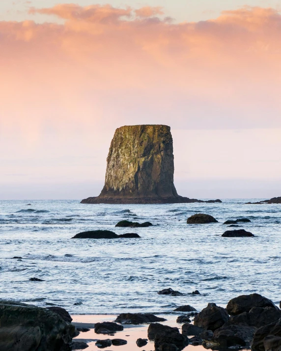 a very large rock formation near the water