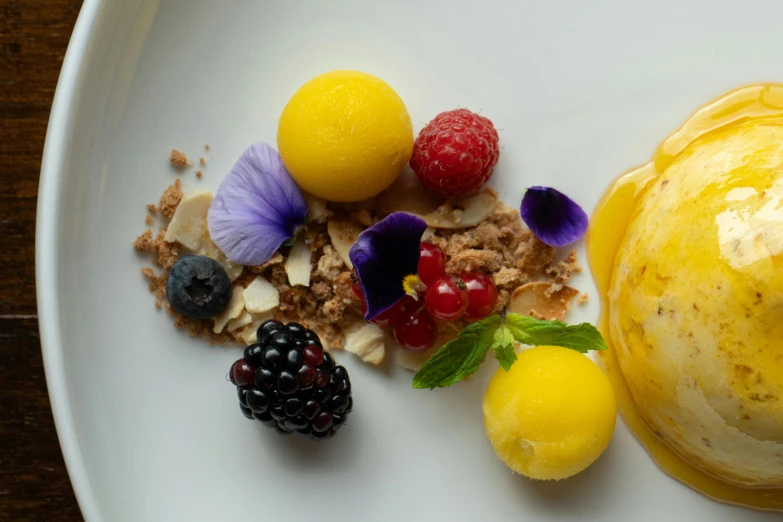 a plate full of different types of fruits and cake