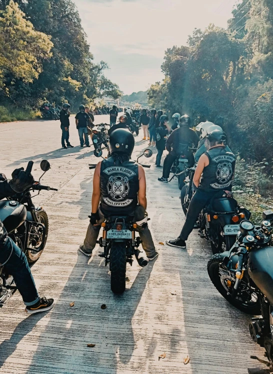 a group of people in black motorcycle clothing