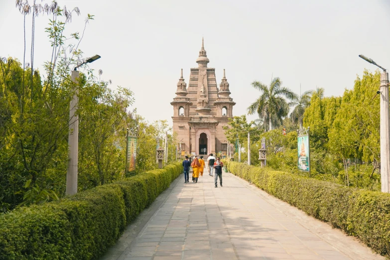 a couple of people that are walking down a walkway