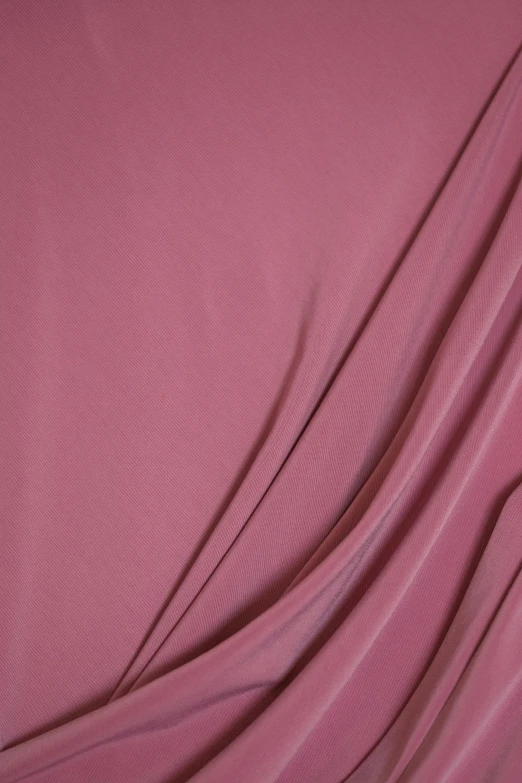 a plain, purple fabric is folded down