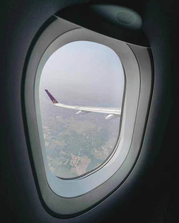 view out the window of an airplane wing