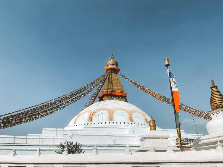 a white and orange building with a big dome