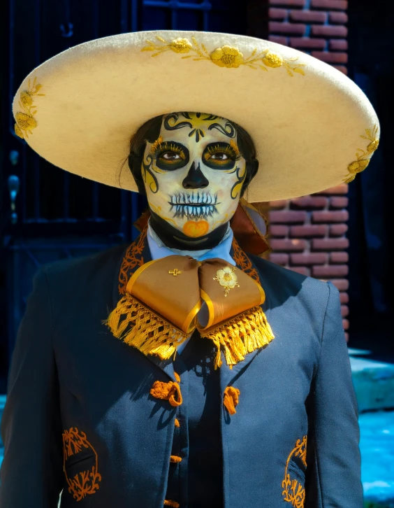 the skeleton is wearing a mexican hat for a picture