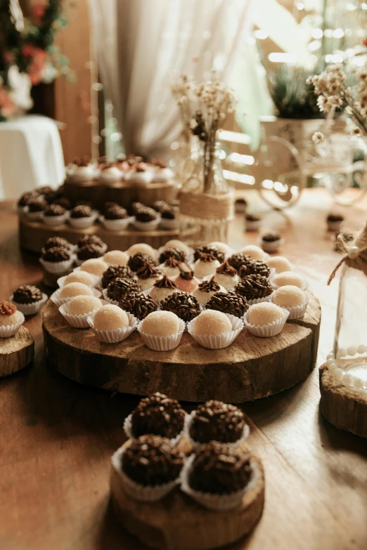 donuts and cookies on wooden plates on a table