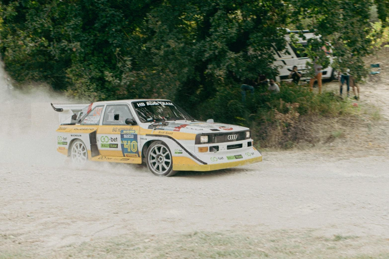 an automobile that is driving in the mud