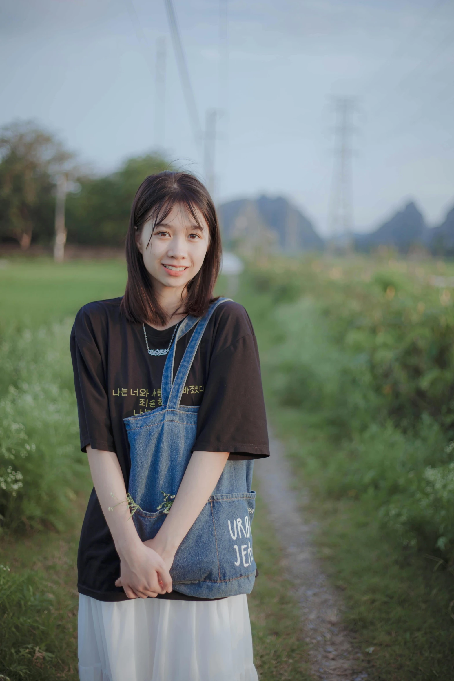 a person standing in front of grass