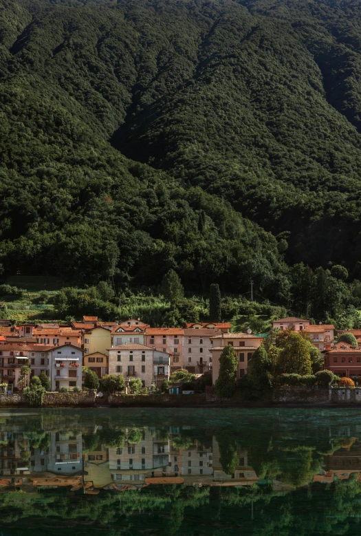 there are mountains in the back ground, and there is the city that has many buildings