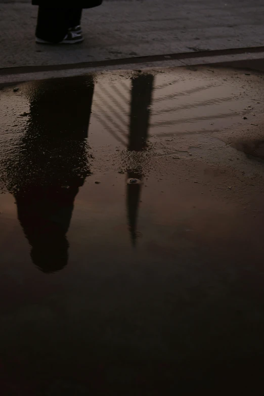 a person walking by a large dle of water