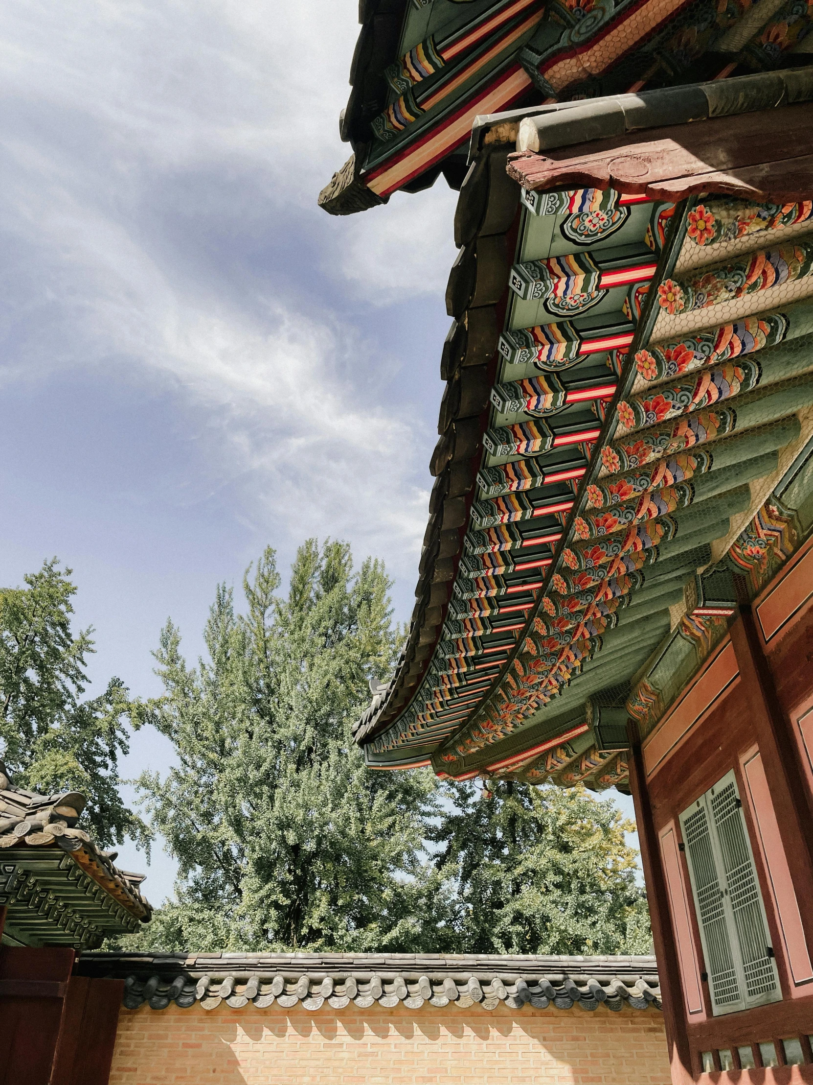 two roofs are shown with green roof tops