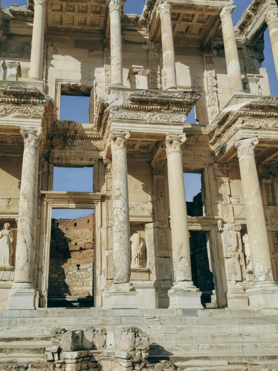 the ruins of a building are covered with columns