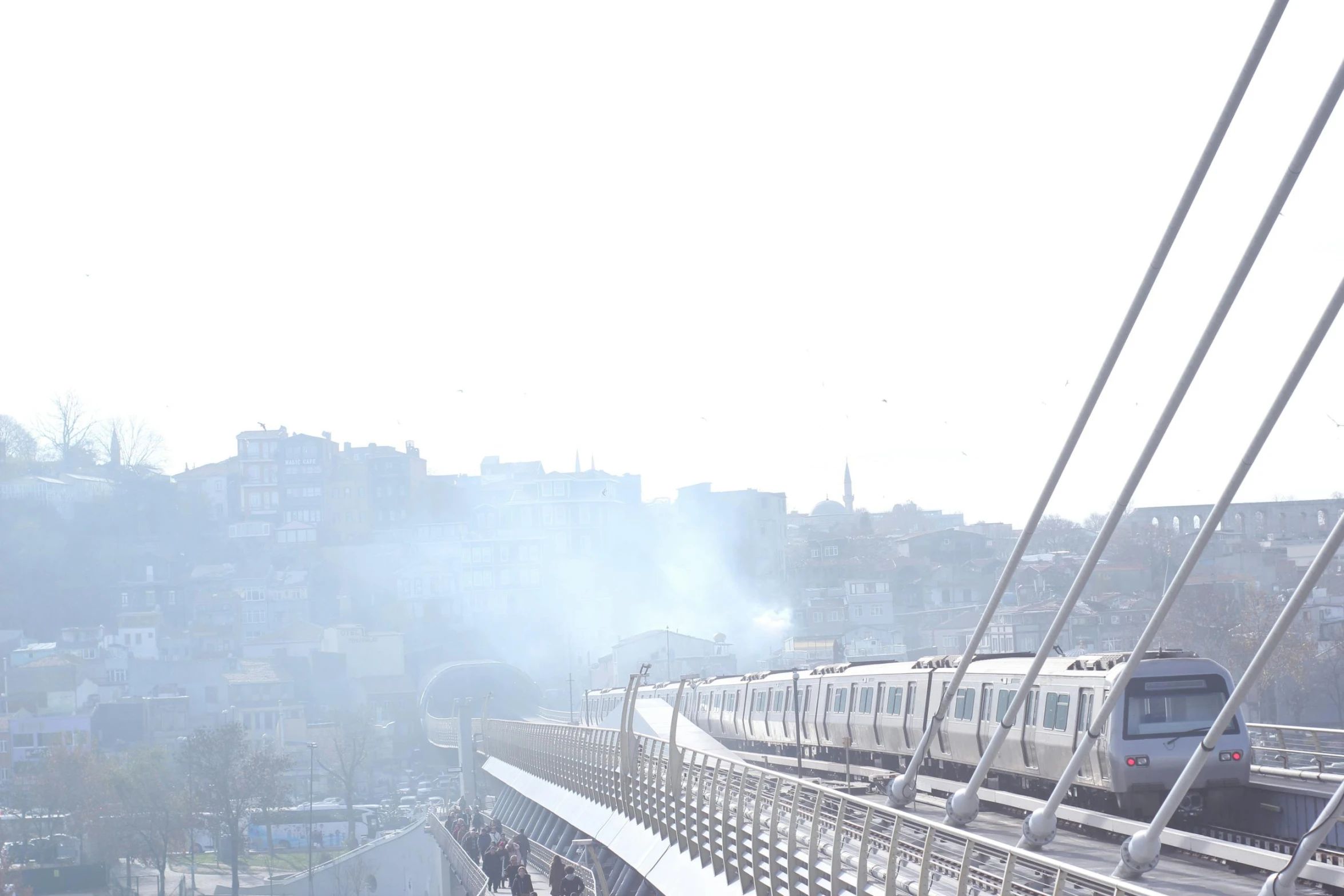 a passenger train traveling over a high bridge