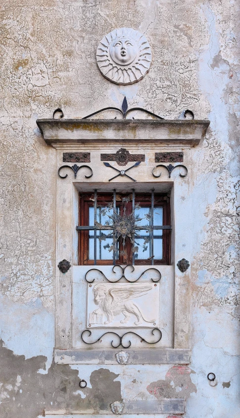 an open window and a coat rack on a stucco building